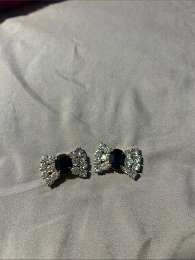 Elegant Black and Gold Bow Brooch Set with Clear Crystals